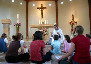 Children of Hope chapel with parents and children seated casually