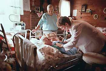 An old woman in a hospital bed