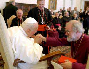 JPII kisses the hand of Rowan Williams