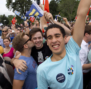 Homosexuals celebrating same sex 'marriage' by kissing each other