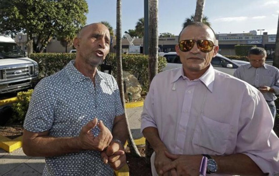 Anti-Castro protestors Efrain Rivas and Arturo Suarez