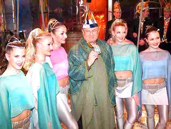 Cardinal Karl Lehmann dressed as a fool surrounded by immodestly dressed women