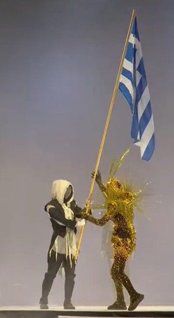 Faceless man delivers the olympic flag to the Golden Traveler